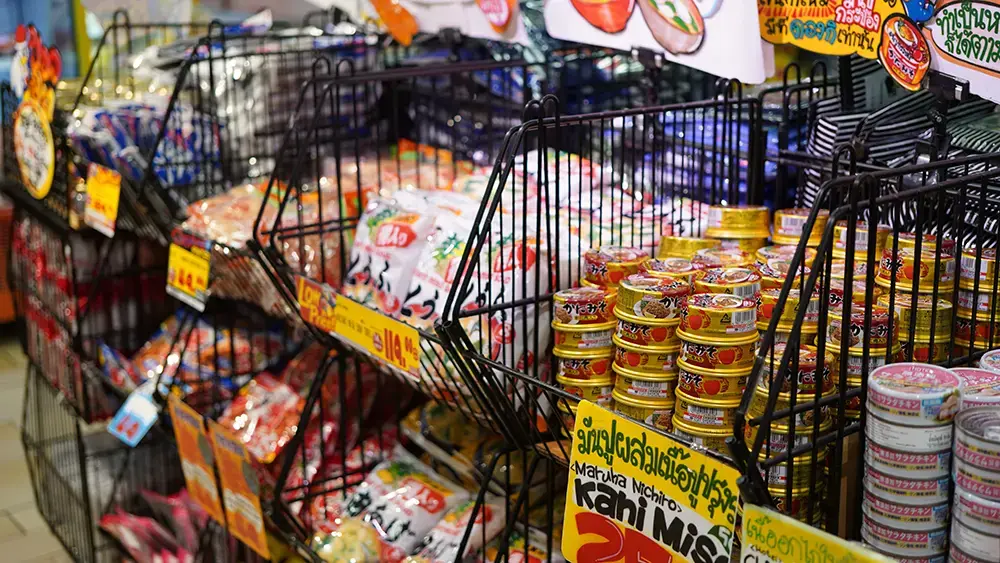 Shows grocery displays of colorful food items, highlighting how creative packaging helps brands stand out.