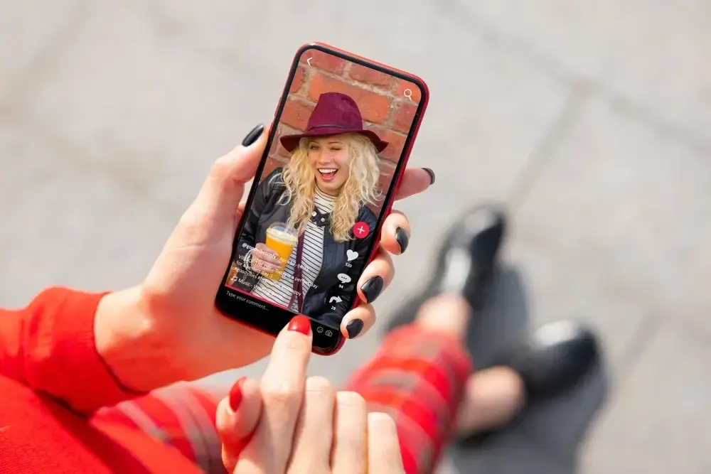 A woman watches her favorite food influencer’s content, appreciating their trend-savvy updates.