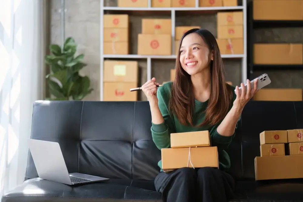 A micro business owner smiles, celebrating the success of their eCommerce venture.