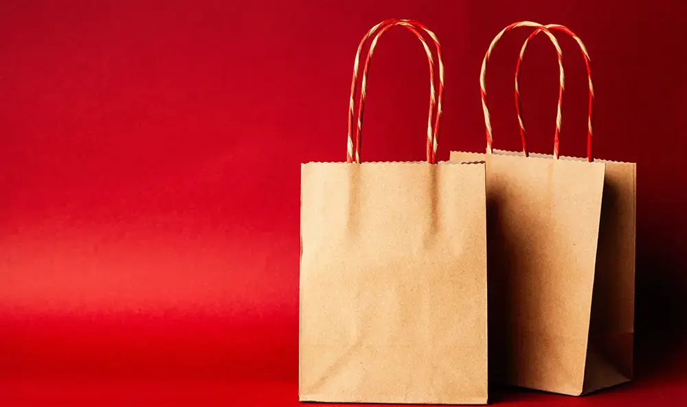 Shows simple brown paper bags that are perfect for food packaging.