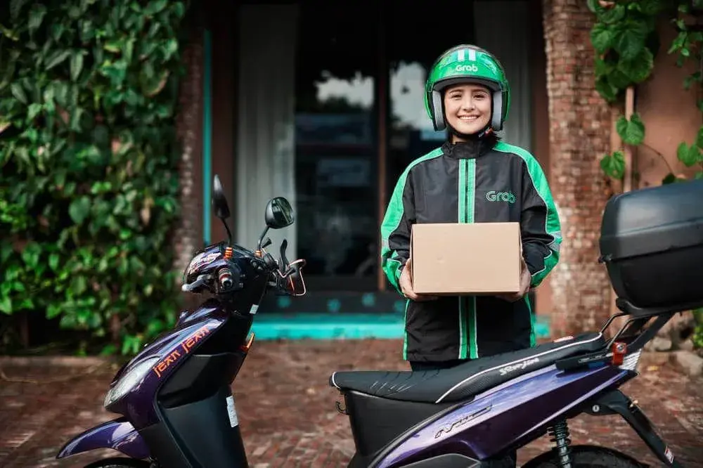 Shows RUSH and Grab's partnership that allows merchant orders to be shipped via GrabExpress.