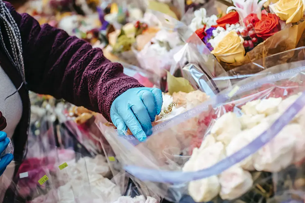 A flower vendor selling bouquets on Valentine’s Day, emphasizing seasonal marketing strategies.